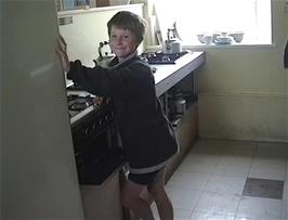 Alasdair prepares breakfast in the hostel kitchen